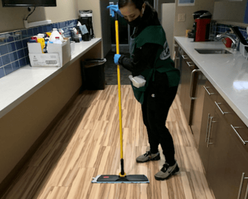 Rangel crew member mopping commercial floors